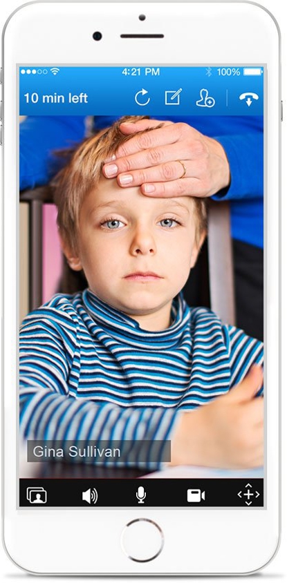 White handheld device displaying child with adult hand over forehead